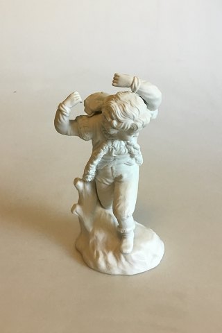 Royal Copenhagen Bisque Figurine of Boy carrying ?