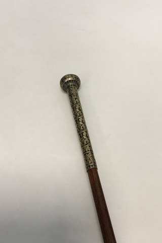 Walking stick of lacquered wood with silver handle