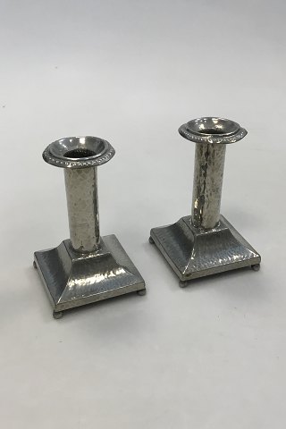 A Pair of hammered candlelight holders made of Pewter