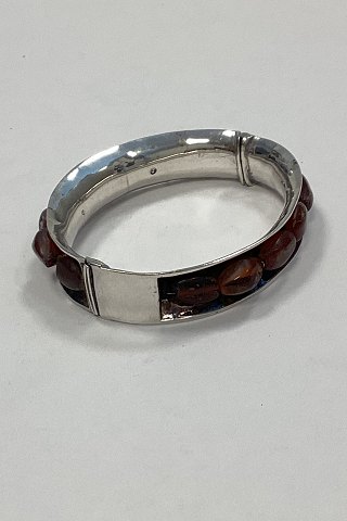 Bracelet in Sterling Silver decorated with pieces of amber