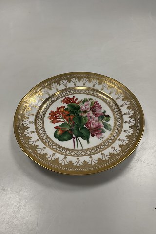Royal Copenhagen Antique Plate with Flower Motif and gold. Signed by Christian  Klein from 1820-1850